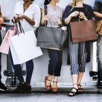 Female friends out shopping together