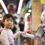 Artificial Intelligence helping humankind -A robot and a girl standing_ Blurbgeek