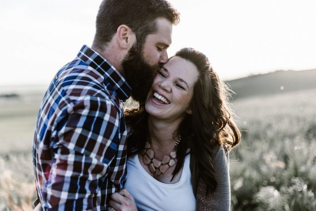 Bearded man showing love to his Girl