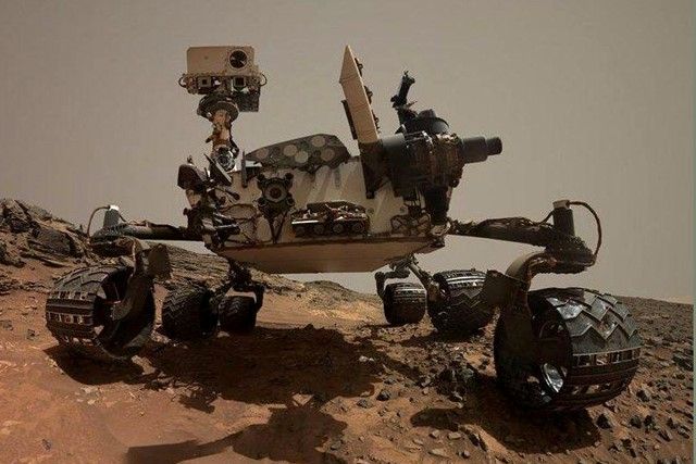 Curiosity rover Wandering on Mars to Gather Data of Planets Atmosphere and Land