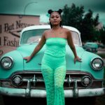 Late 1990s Fashion – A girl standing in front of a car_ Blurbgeek