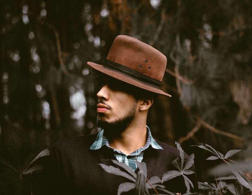 Vintage Style look of a man wearing hat and sweater.