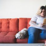 A fat woman is sitting on a couch | Blurb geek