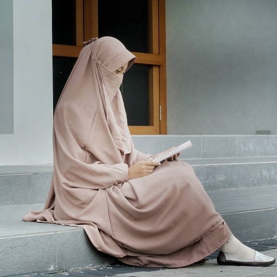 Girl in Hijab Reciting Holy Quran
