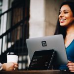 Girl with in blue shirt is sitting on a laptop | Blurb geek