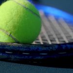 Green Colored Tennis ball on a Racket | Blurb geek